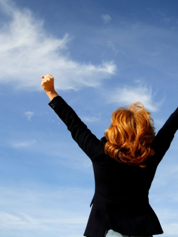 Businessman shouting her victory to the world